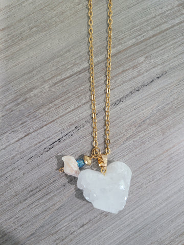 Gold color necklace with stone charm, blue bead, and real seashell