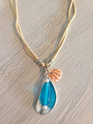 Double cotton cord necklace with blue stone and silver color charm, and real seashell