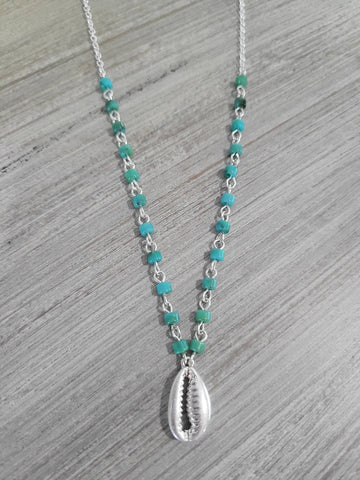 Silver color necklace with aqua green beads and shell charm