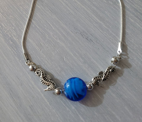 Seahorse necklace with blue glass bead charm