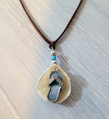 Brown suede single cord necklace with shell and beach sandal charm