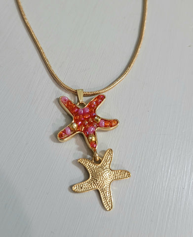 Gold plated necklace with 2 starfish charms