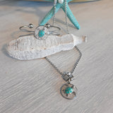 Stainless steel set of necklace, bracelet, and earrings, with sea turtle charm.