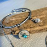 Stainless steel set of necklace and bangle bracelet with sea turtle charms.