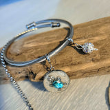 Stainless steel set of necklace and bangle bracelet with sea turtle charms.