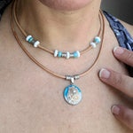 Leather cord necklace with real seashell.