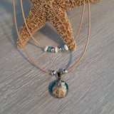Double cord necklace with real seashell.