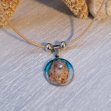 Cord necklace with real seashell.