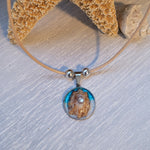 Double cord necklace with real seashell.