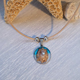 Cord necklace with real seashell.