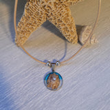 Cord necklace with real seashell.