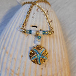 Gold plated necklace with starfish charm.