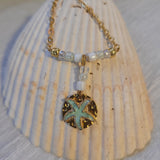 Gold plated necklace with starfish charm.