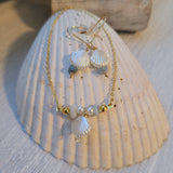 Gold plated necklace and earring set with faux pearlized shell
