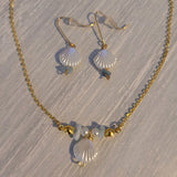 Gold plated necklace and earring set with faux pearlized shell